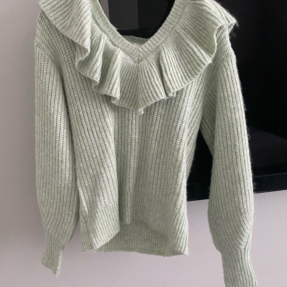 Knitted sweater.